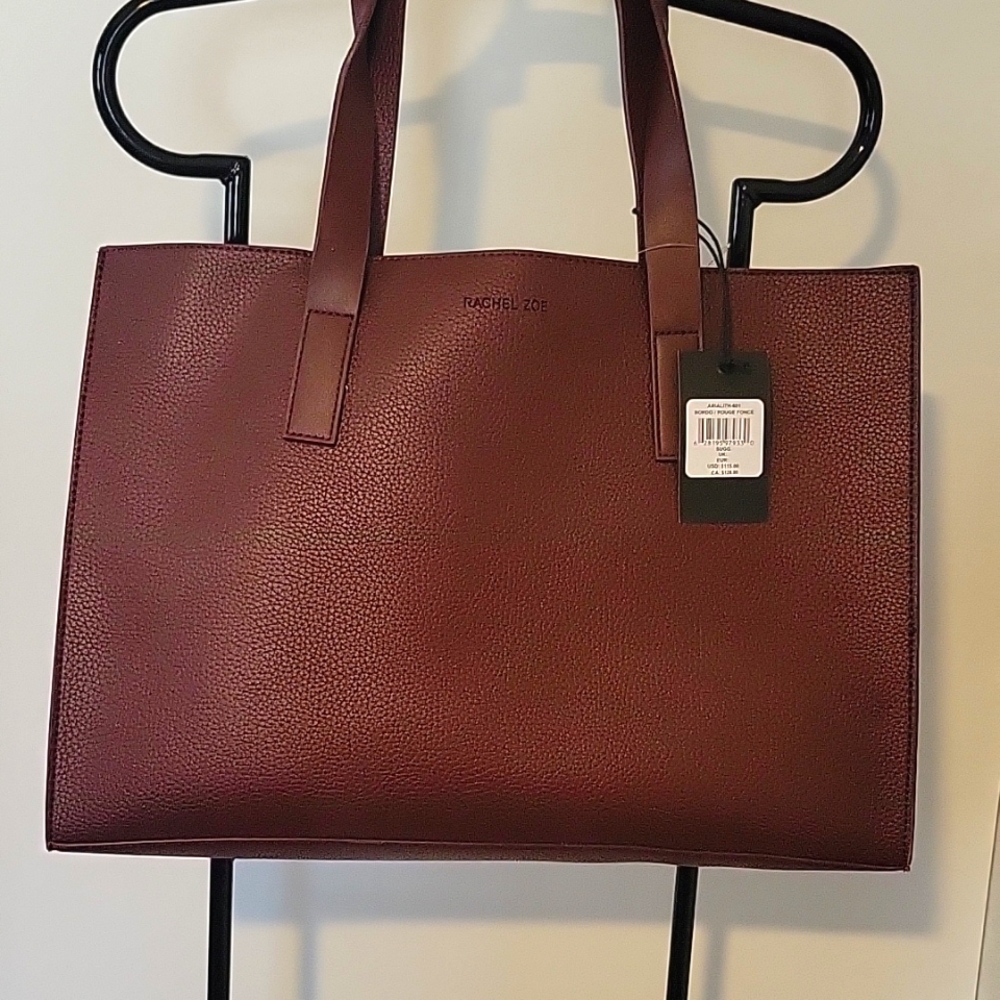 Brand new tote. Plum colored faux leather